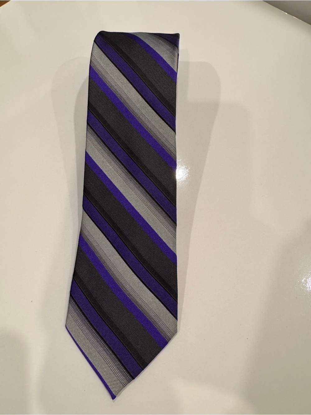 NWT Calvin Klein 100% silk striped necktie in purple, grey/silver and black.